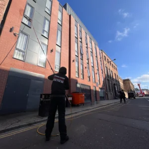 One of our Window Cleaners cleaning a student commendation